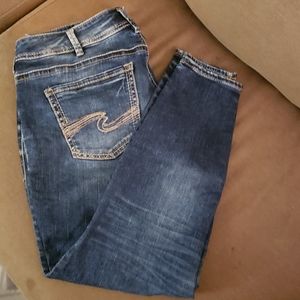 Silver skinny jeans.